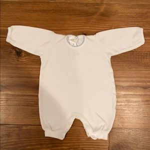 White outfit with blue trim